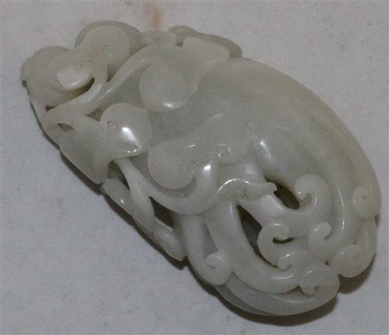 A Chinese white jade carving of a finger citron, lingzhi fungus and fruit sprigs, 19th/20th century, 10.5cm